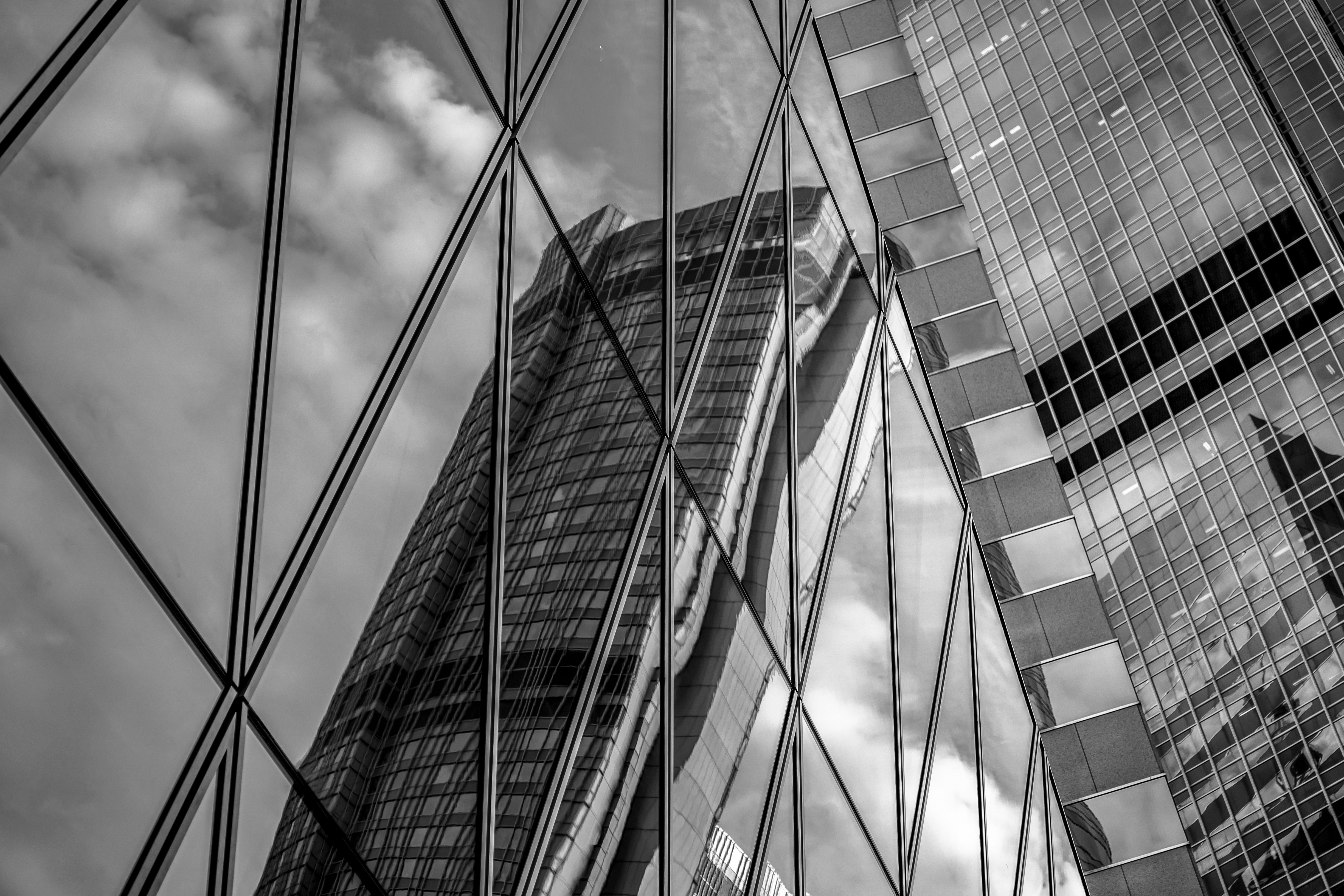 A modern building reflecting off another building