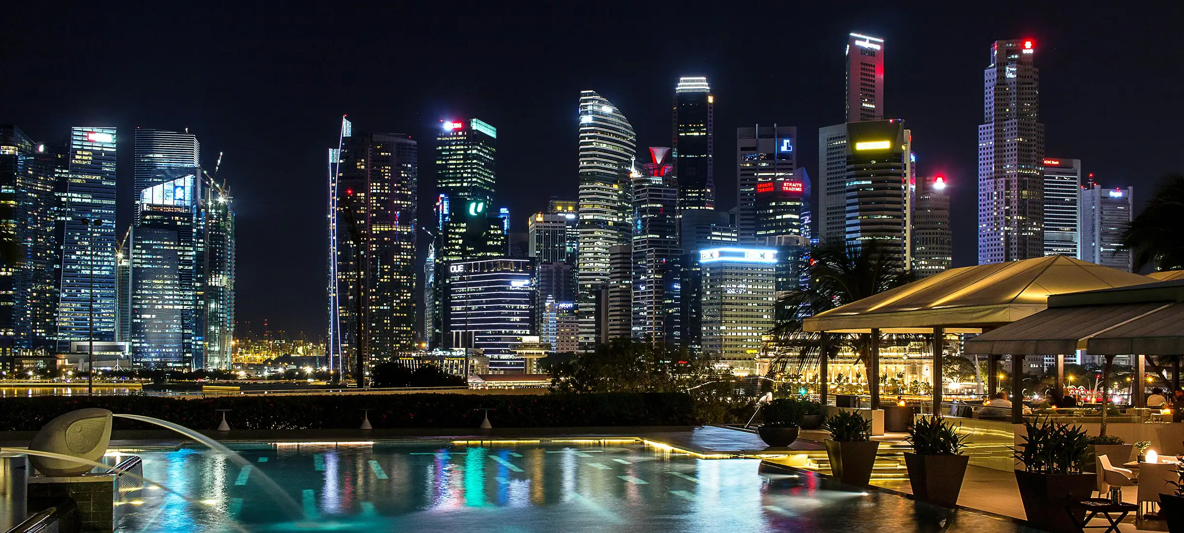 Modern Dubai skyline at night representing property listings
