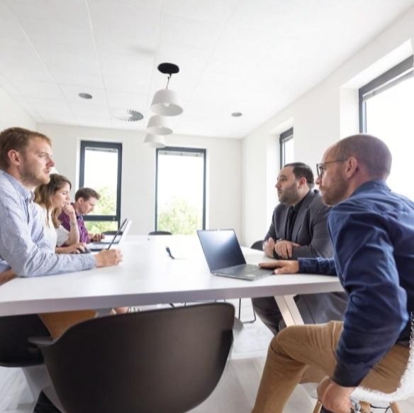 grayscale photo of people walking towards building