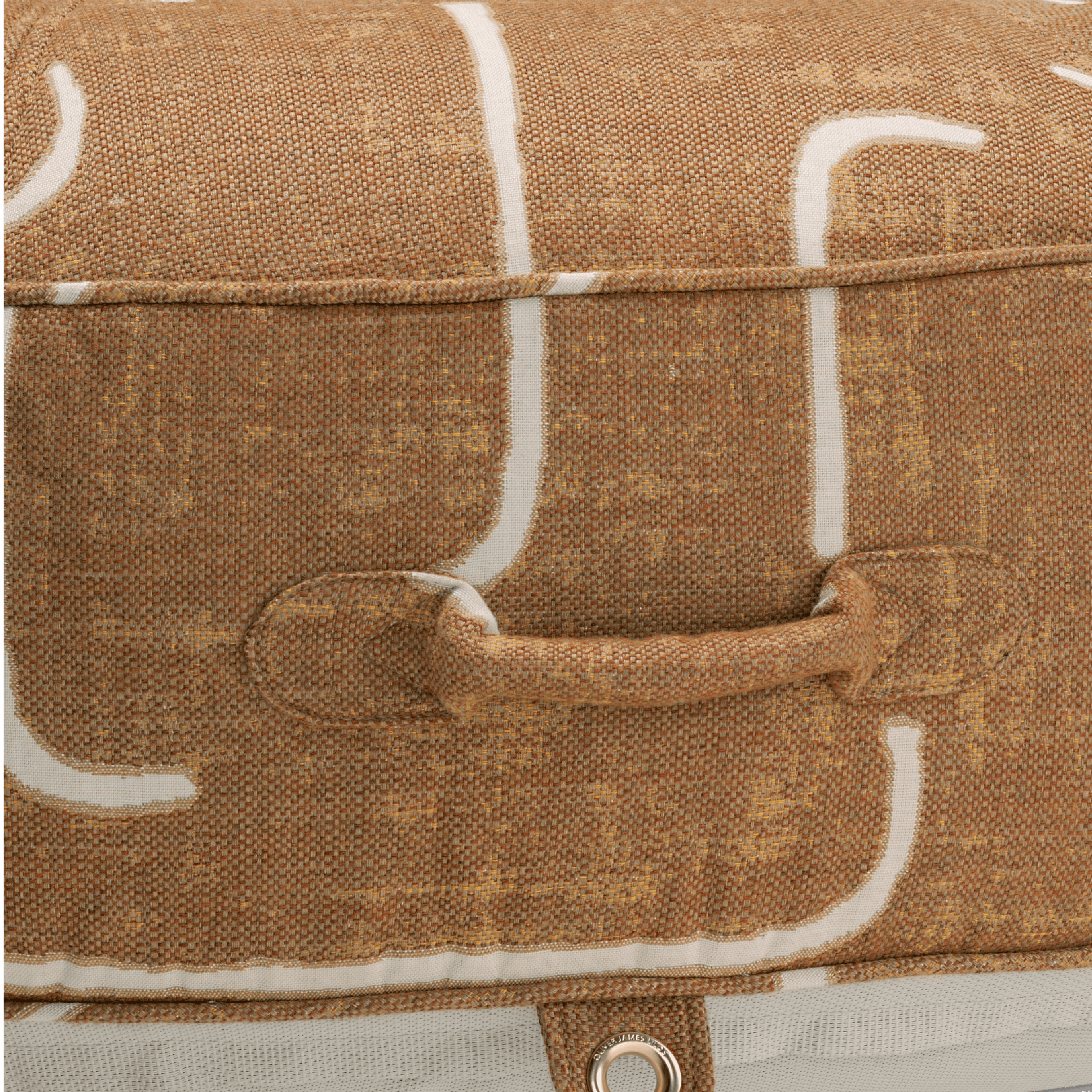 Close-up of pool float showing gold-and-brown weave handle, gold stainless eyelet, and thick textured fabric