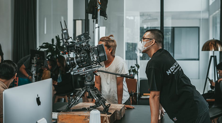 professional camera crew filming a panel discussion at a corporate event - corporate event highlight reel