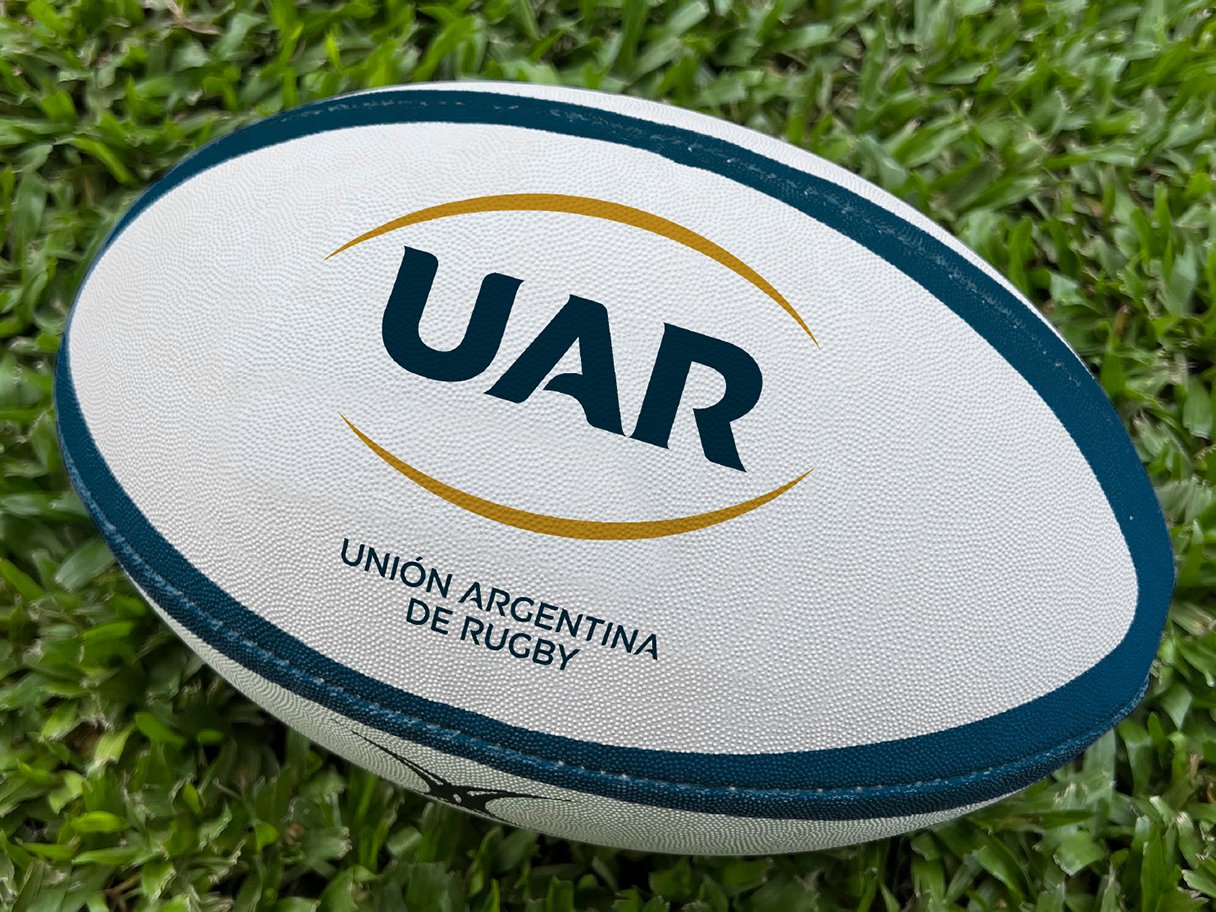 Rooftops of a coastal town with the sea in background