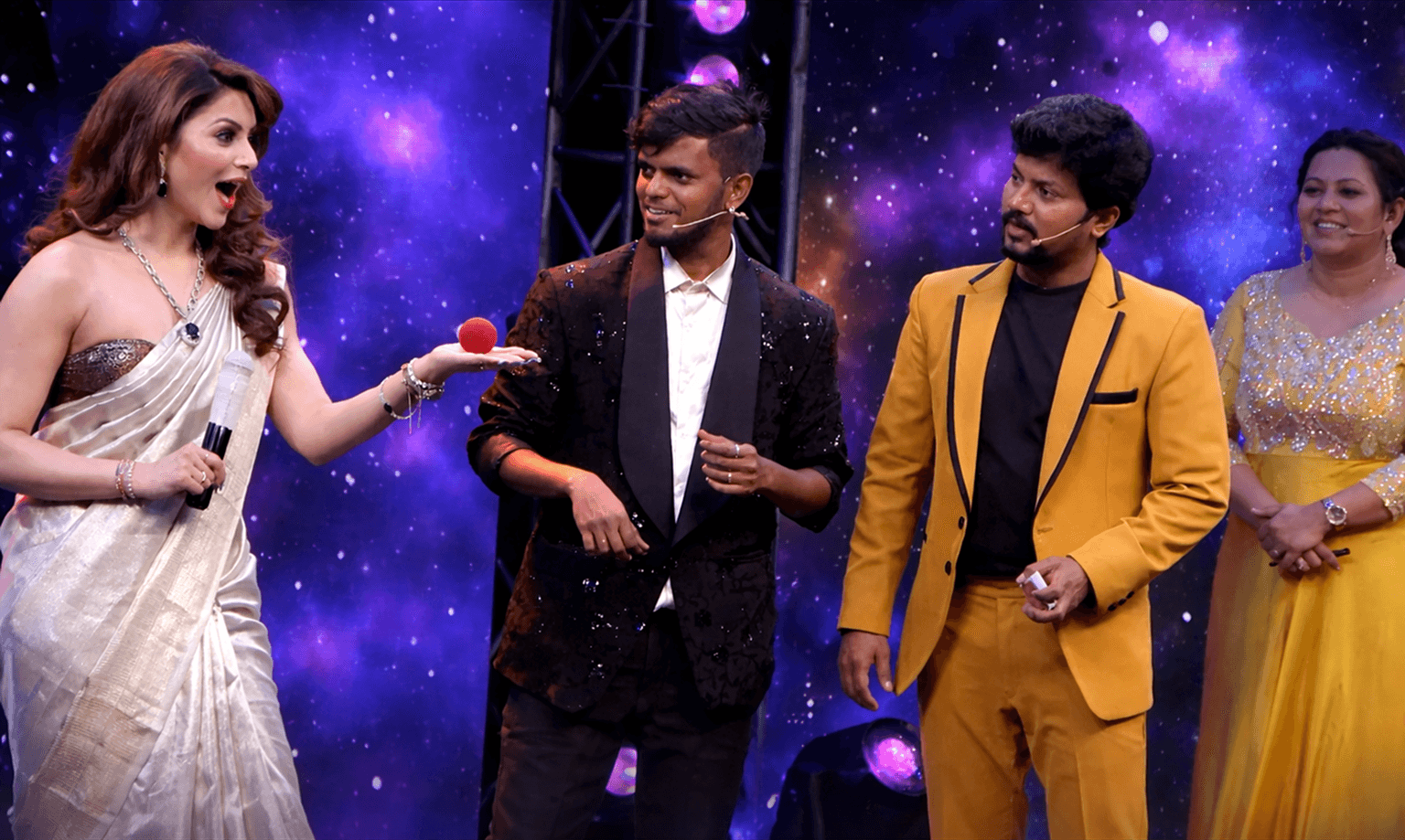 Magician Vicky Krish performing Stage Magic for audience