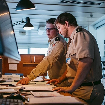 Hand holding a mobile phone showing an open position