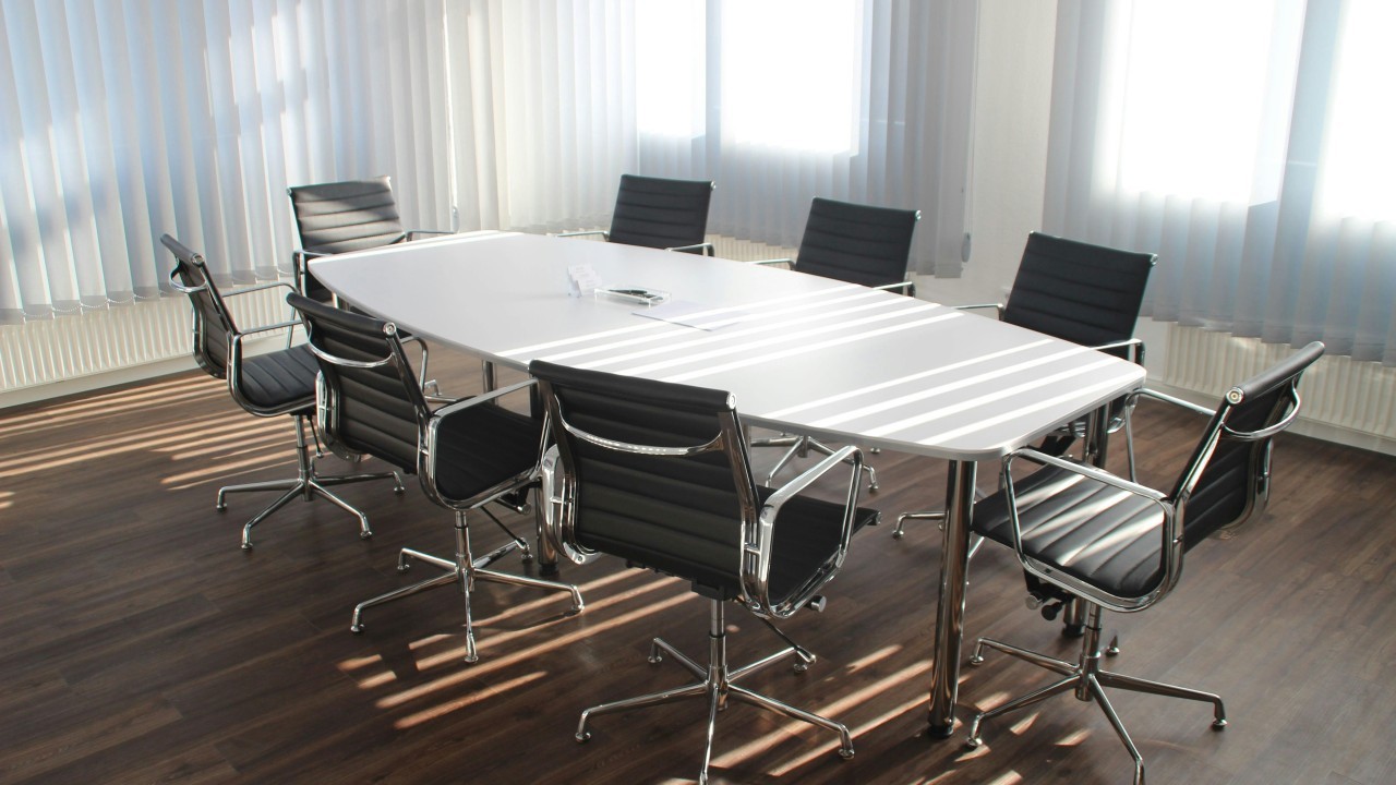 Empty office table with chairs in a conference room