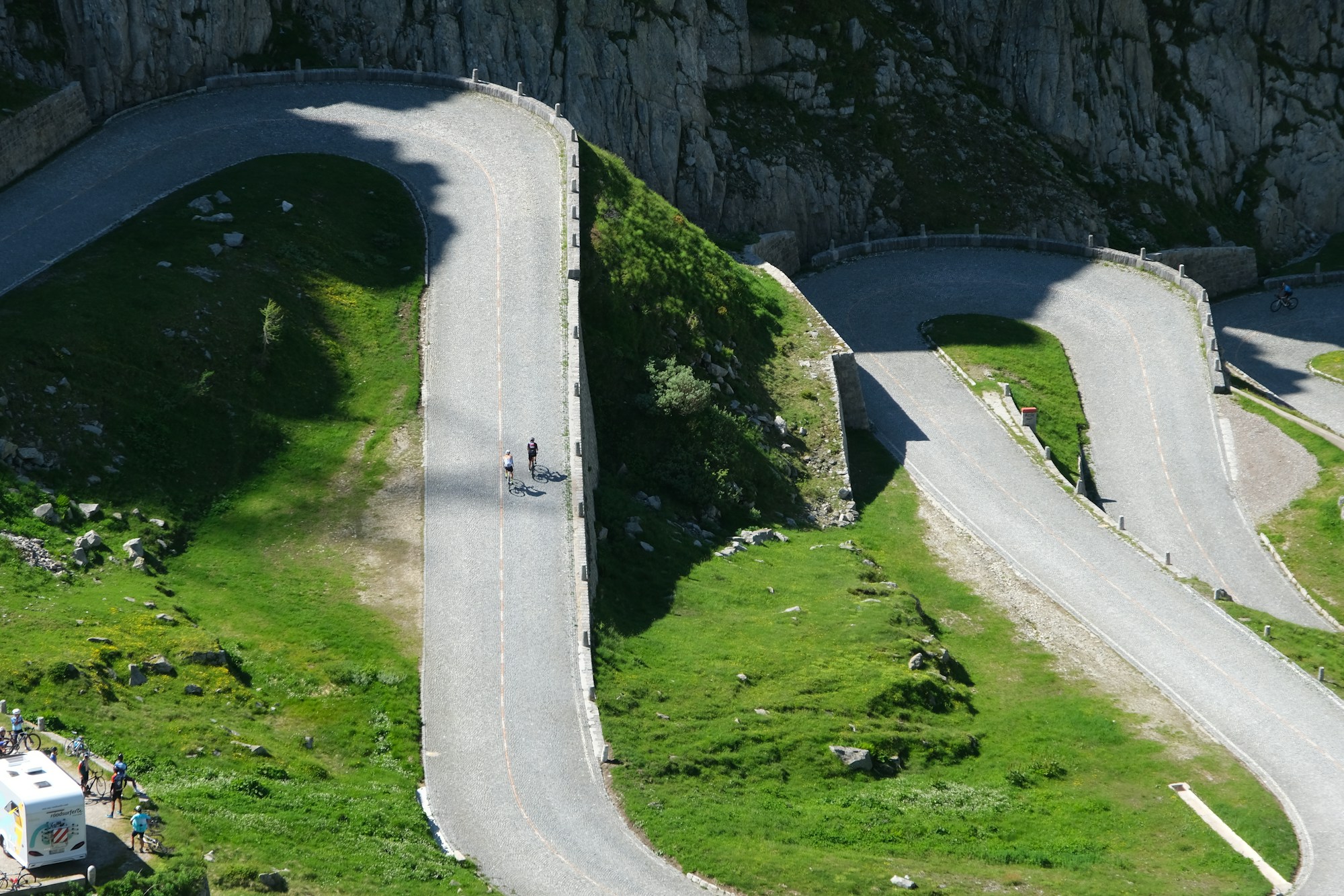Aerial view of a mountain road with hairpin bends