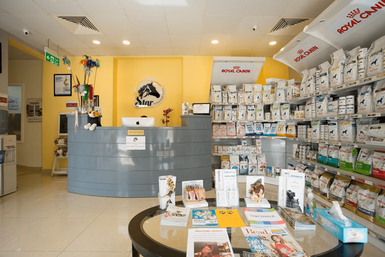 Interior  of Star Veterinary Clinics in Dubai, showing reception area, resources on animal health and wellness, dog food, and other pet care needs