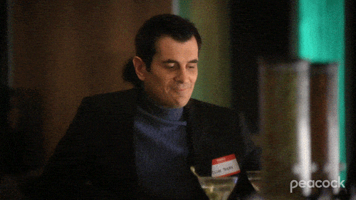 GIF animation of Phil Dunphy from Modern Family trying to look cool.