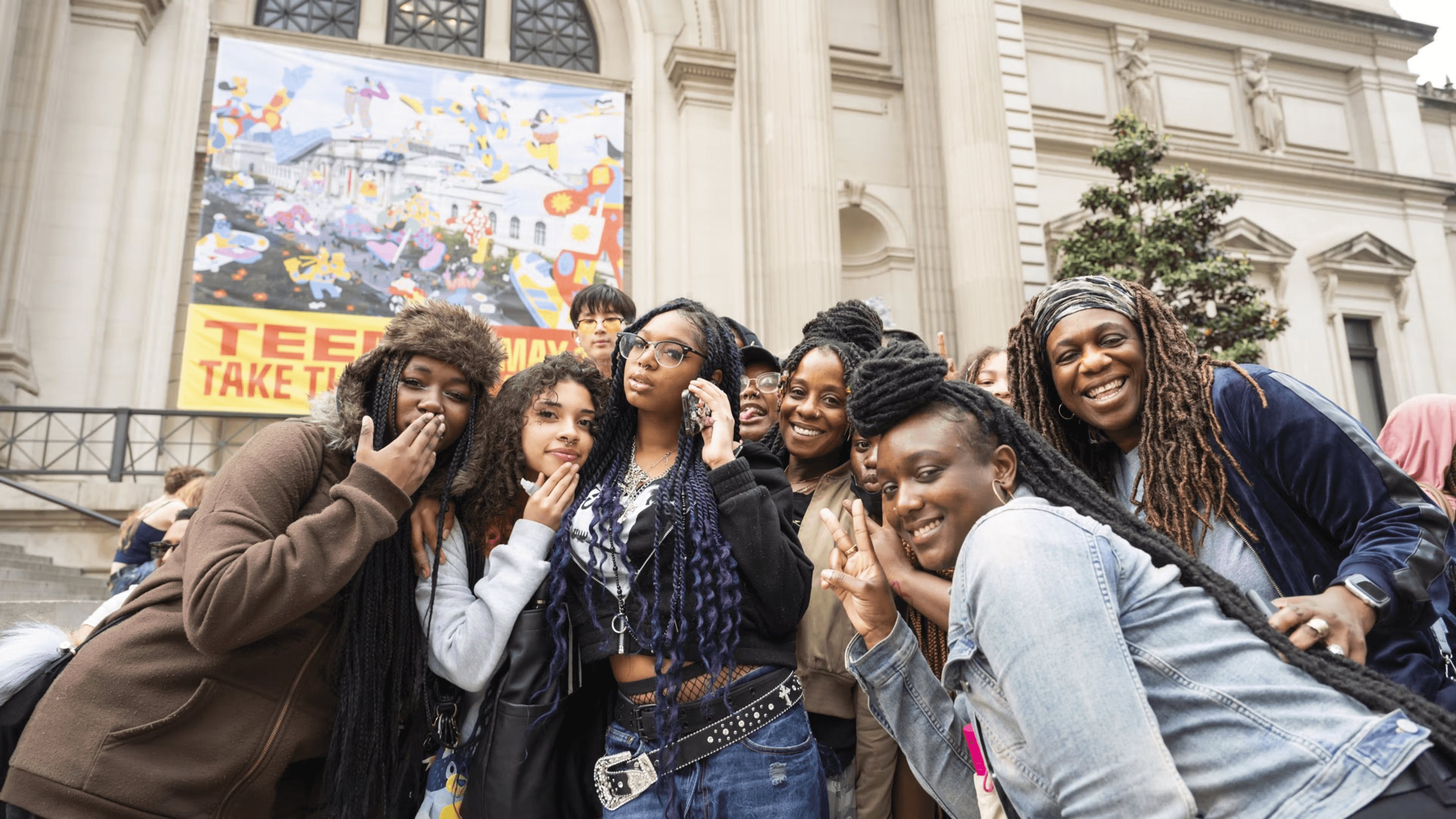 High school student standing in front of art exhibits at the Metropolitan Museum of Art in New York City