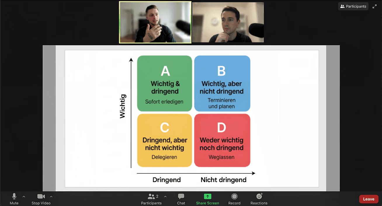 two men facing each other while shake hands and smiling