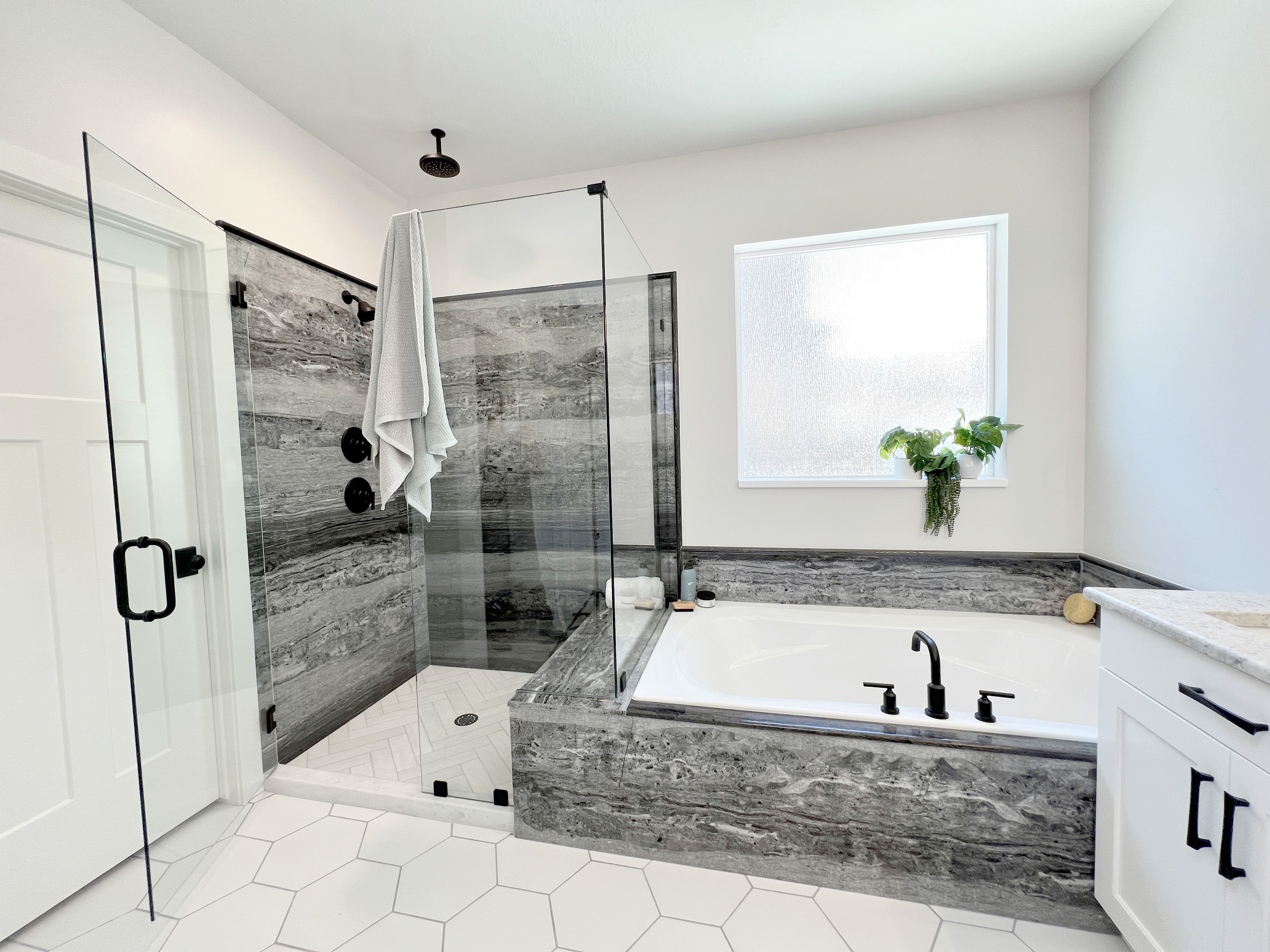 Tyvarian gray walk in shower and built in soaking tub