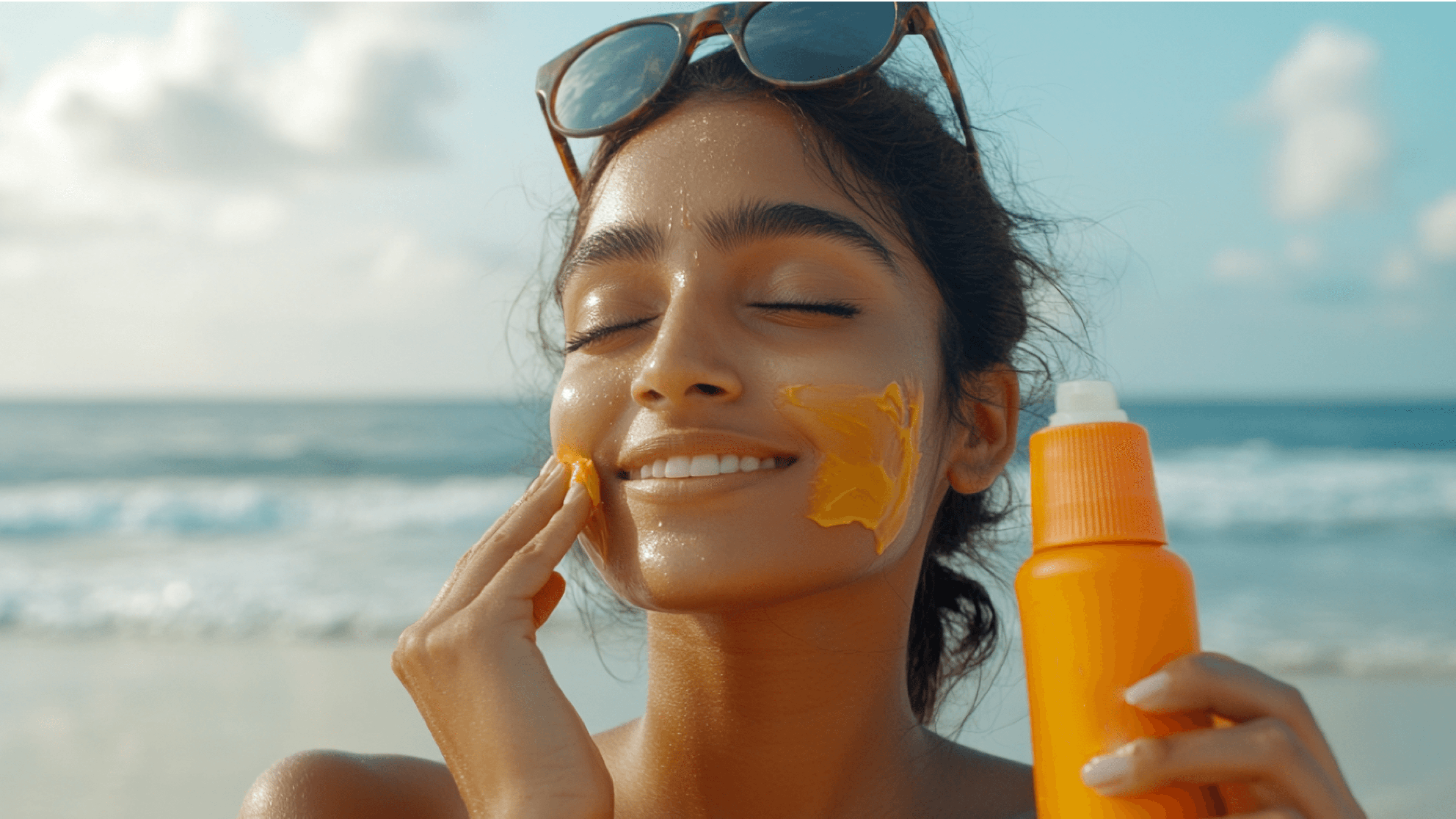 Young woman smiling while applying sunscreen to her face, enjoying a sunny beach day, emphasizing the importance of sun protection for healthy skin, even during winter. Nivea Soft Light Moisturizer Cetaphil Moisturizing Cream Pond’s Cold Cream Plum E-Luminence Deep Moisturizing Crème Himalaya Nourishing Skin Cream Vaseline Intensive Care Cocoa Glow Dove DermaSpa Winter Care Lotion Mamaearth CoCo Body Lotion L’Oréal Paris Revitalift Hyaluronic Acid Serum The Ordinary Hyaluronic Acid 2% + B5 Eucerin Advanced Repair Cream Kiehl’s Ultra Facial Cream Nivea Cocoa Butter Body Lotion Vaseline Aloe Soothe Lotion L'Oréal Paris Hydra-Total 5 Daily Moisturizer Maybelline Baby Lips Biotique Bio Fruit Whitening Lip Balm Lotus Herbals Safe Sun 3-in-1 Matte Sunscreen Neutrogena UltraSheer Dry-Touch Sunscreen Nivea Hand Cream Glycerin & Beeswax The Body Shop Almond Milk Hand Cream Dove Deep Moisture Body Wash Cetaphil Gentle Skin Cleanser Vaseline Healthy White Lightening Lotion L'Oréal Paris Revitalift Brightening Moisturizer Dove Deep Care Body Lotion Burt's Bees Beeswax Lip Balm Vaseline Lip Therapy Innisfree Green Tea Seed Serum Laneige Water Sleeping Mask COSRX Advanced Snail 96 Mucin Power Essence Dr. Jart+ Ceramidin Cream Etude House Moistfull Collagen Cream Sulwhasoo First Care Activating Serum Belif The True Cream Aqua Bomb Skinfood Royal Honey Propolis Enrich Essence Missha Time Revolution The First Treatment Essence Klairs Rich Moist Soothing Cream Pyunkang Yul Moisture Ampoule MISSHA Super Aqua Ultra Hyalron Emulsion Dove Deeply Nourishing Body Wash DOVE Body Love Supple Bounce Body Lotion for Dry Skin DOVE Beauty Cream Bar Imported DOVE beauty Skin whitening cream DOVE Restoring Ritual Body Lotion DOVE Body Love Light Hydration Body Lotion Dove DermaSeries Dry Skin Relief Body Lotion