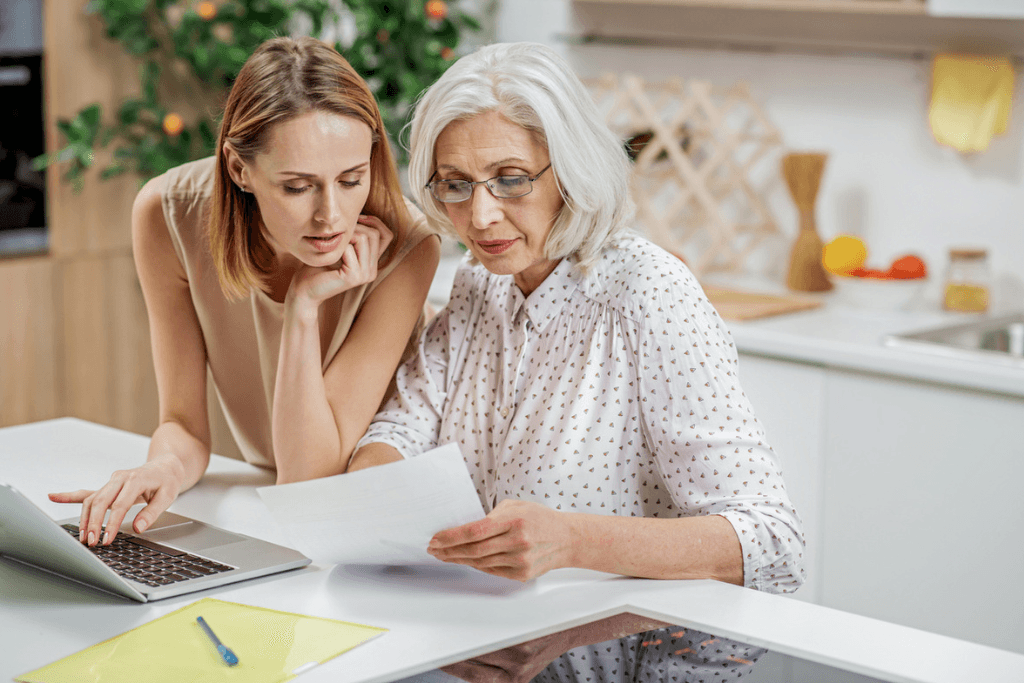 woman helping senior woman