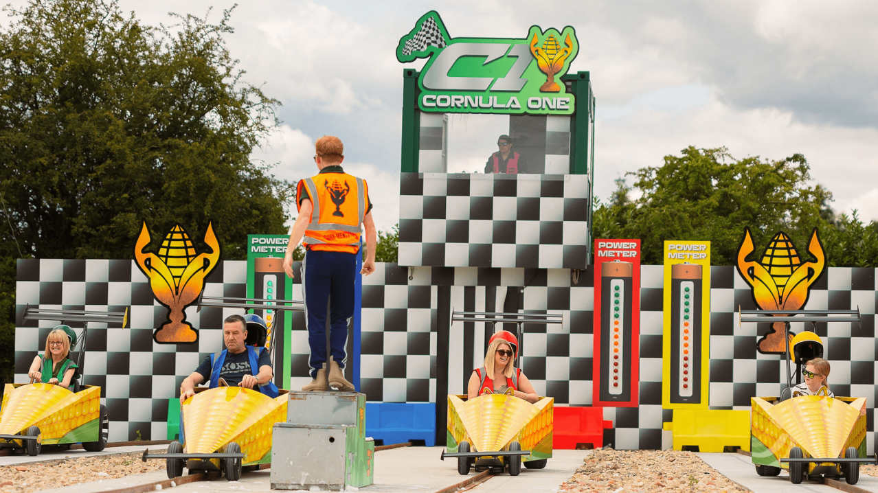 Colorful podium display with checkered backdrop and racing theme elements