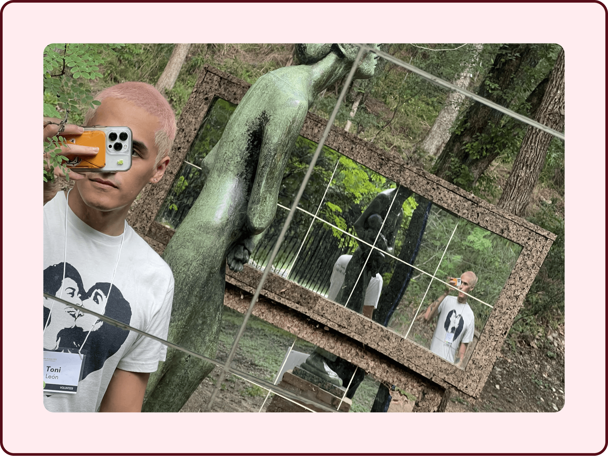 Toni León wearing an AccessU volunteer badge and taking a mirror selfie at Umlauf Sculpture Gardens