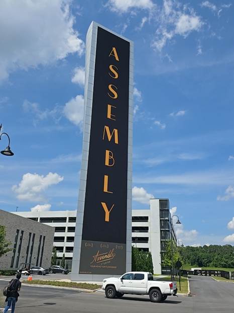 A photo of the giant screen at Assembly Atlanta, taken from the ground
