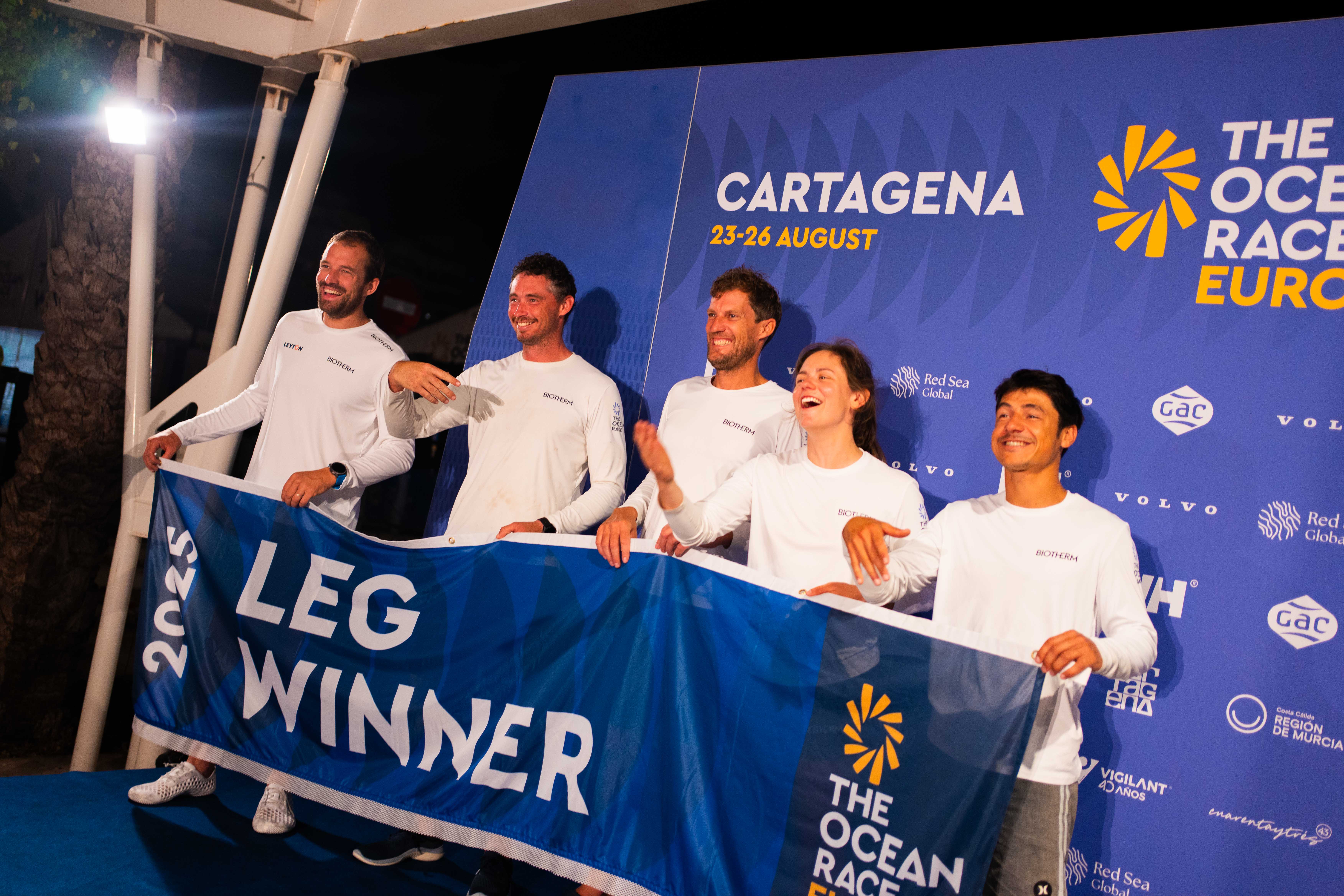 A woman with a head made of mirrors, reflecting light and creating a kaleidoscopic effect around her.