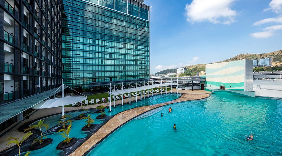 a woman in a red cape standing in the woods