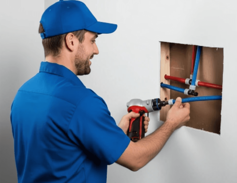 Valley Star crew replacing old pipes with new PEX lines in a Fresno, CA house as part of a whole‑home repipe.