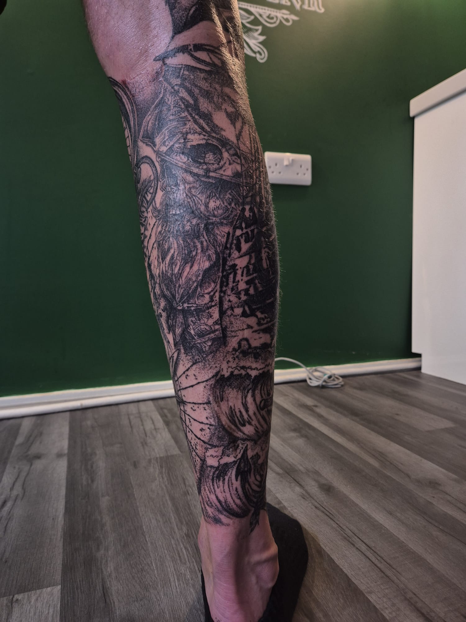 Full black and grey leg tattoo sleeve with detailed shading in Hazel Grove Stockport
