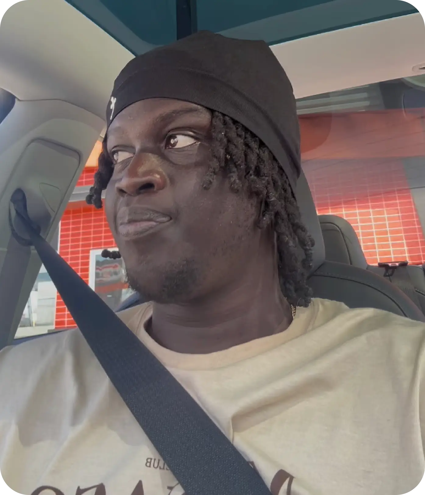 man standing beside wall