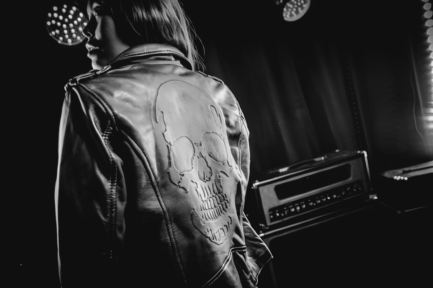 woman in black blazer smiling