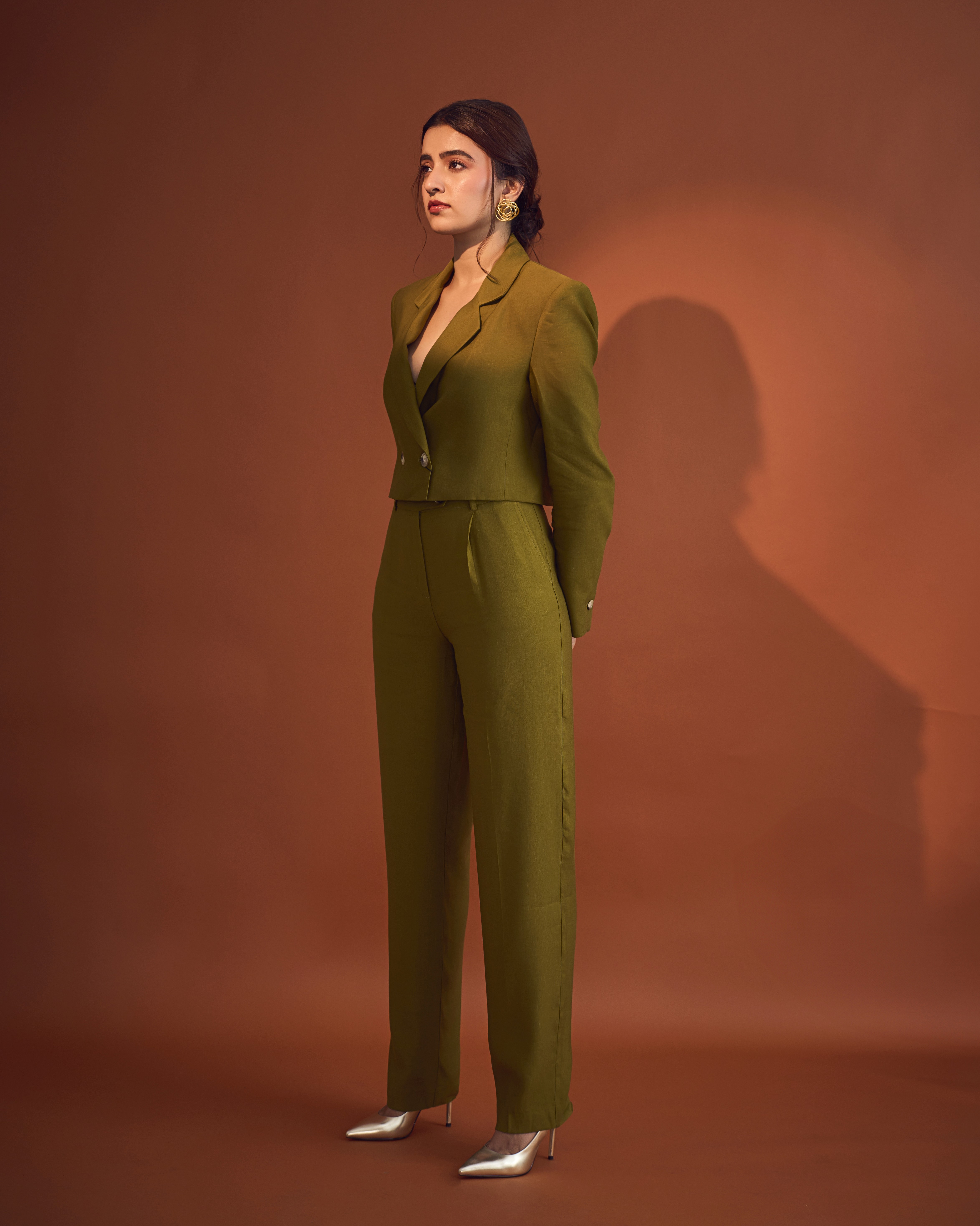 Person sitting on a ledge overlooking New York City skyline