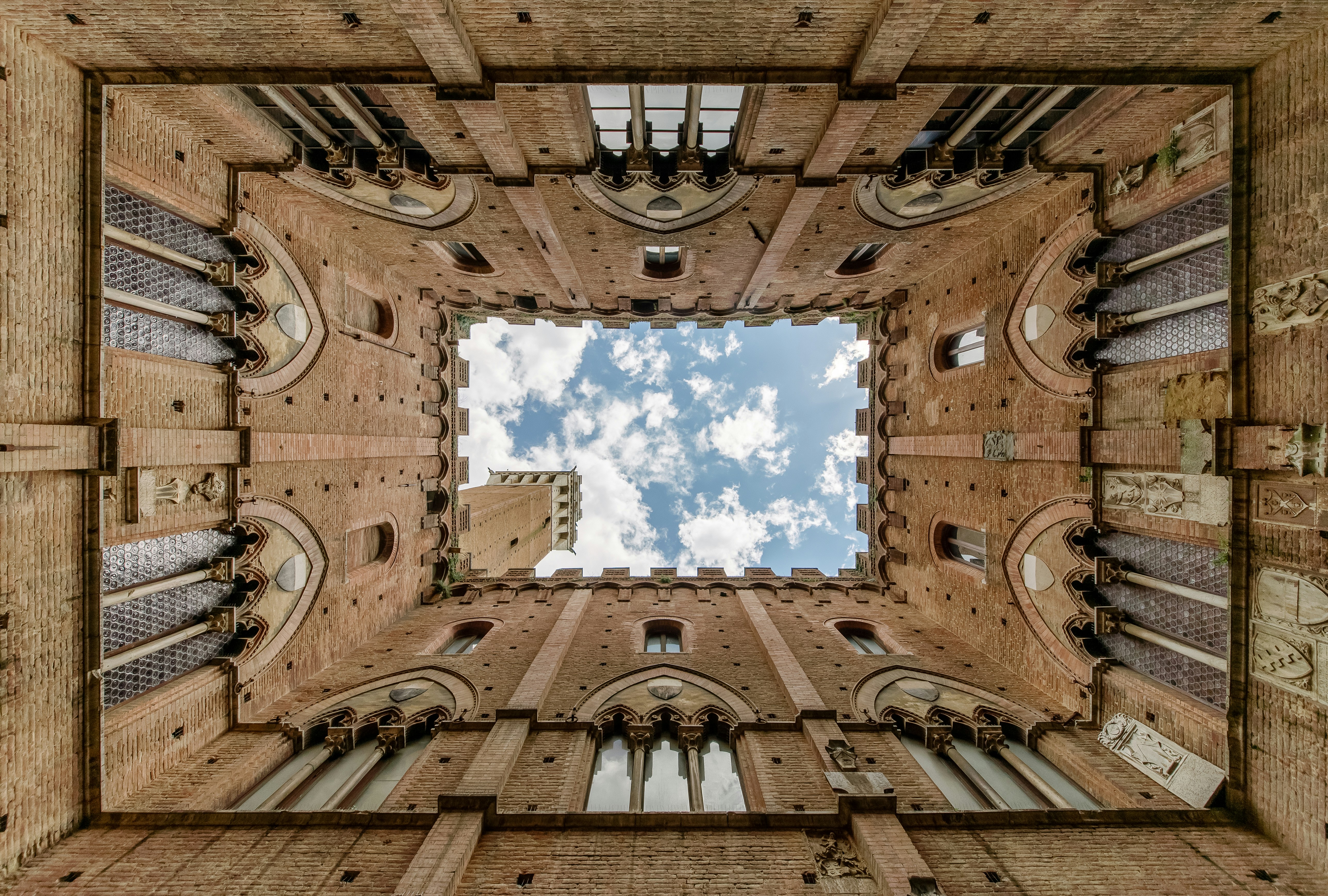 low-angle photography of brown gothic building interior