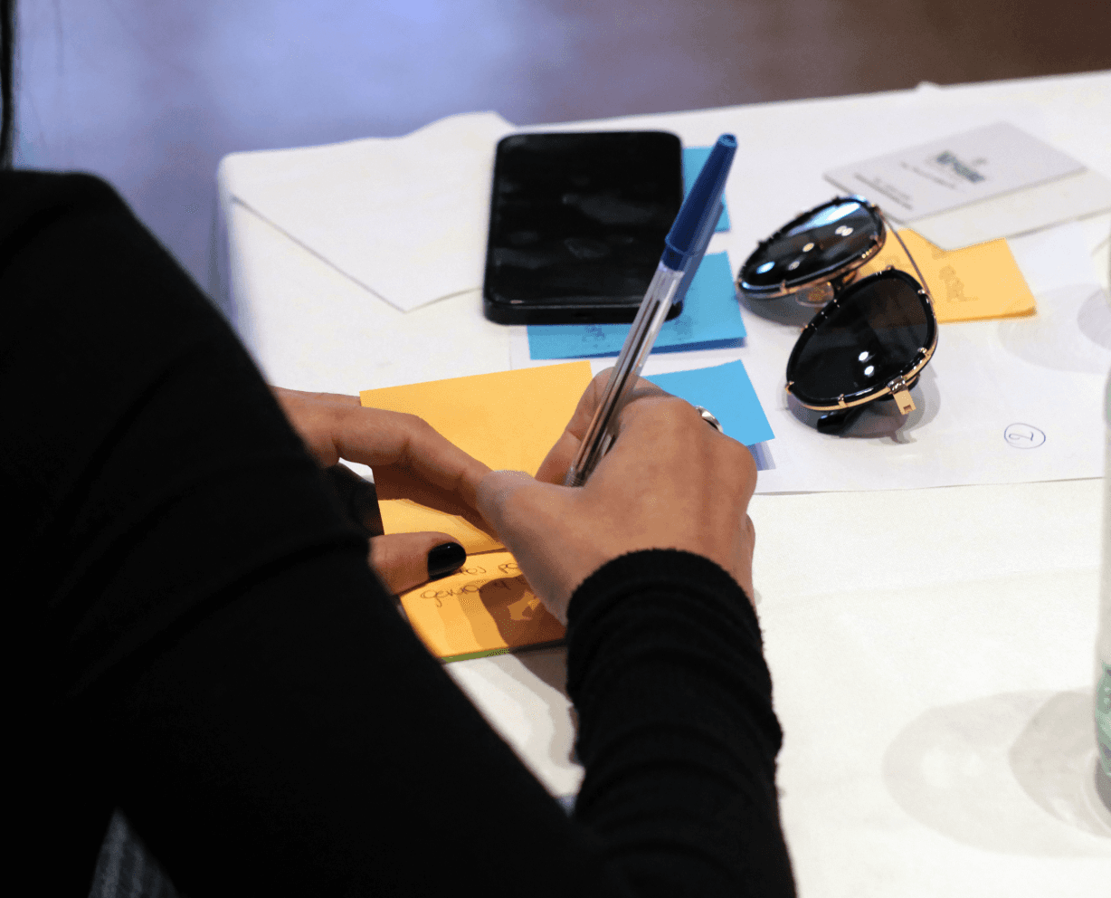 Team member writing Post Its in a bonding activity