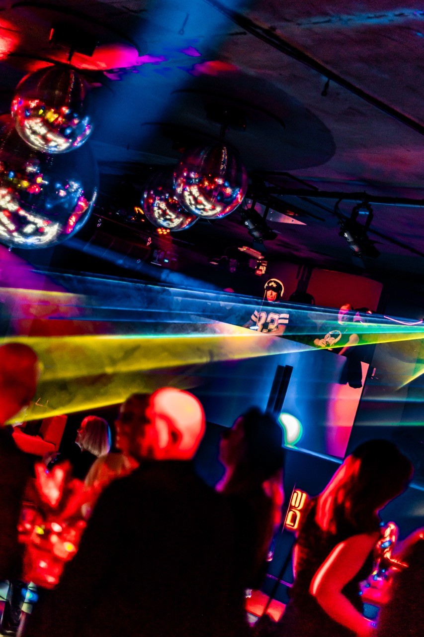 people dancing in nightlife spot