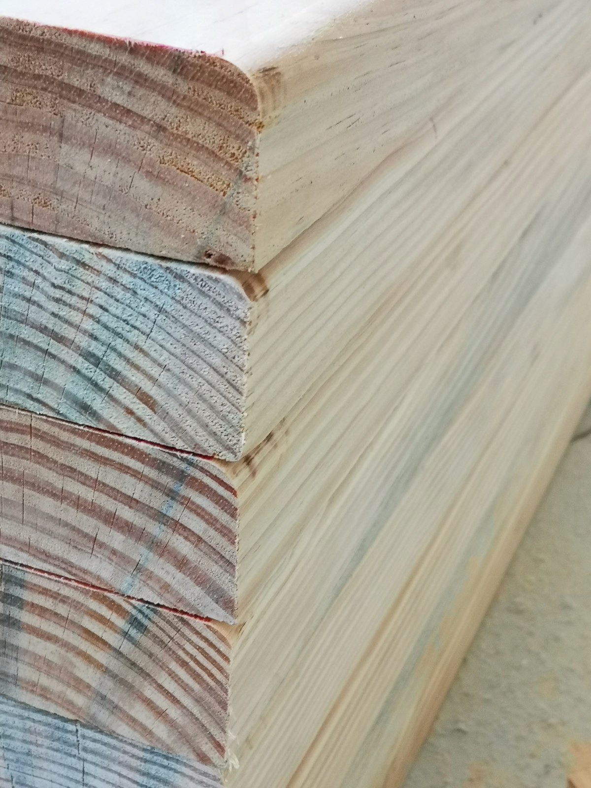 Modern brick and glass building reflecting the blue sky, with pedestrians and cyclists moving through a sunlit urban plaza, creating dynamic motion blur effects.