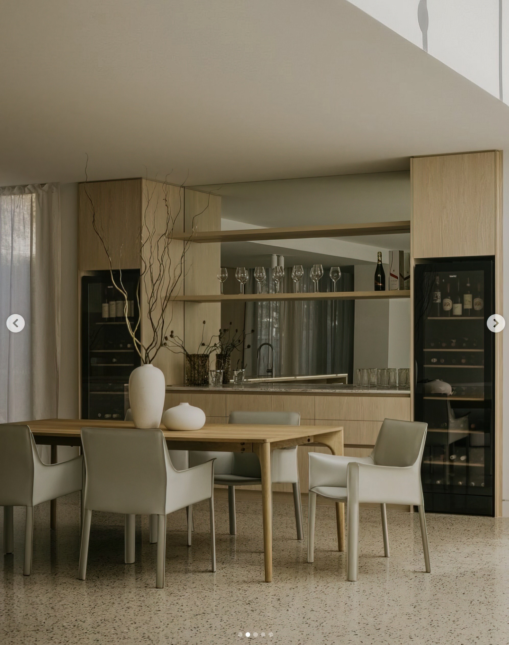 Luxury residential dining and entertaining space designed by Two Style Interiors in Melbourne, Australia, featuring bespoke oak joinery, integrated wine storage, terrazzo flooring, designer dining furniture and a refined contemporary material palette. Photorealistic CGI visualisation by James Lyons of PixelSpaces, showcasing premium residential interior design and architectural rendering.