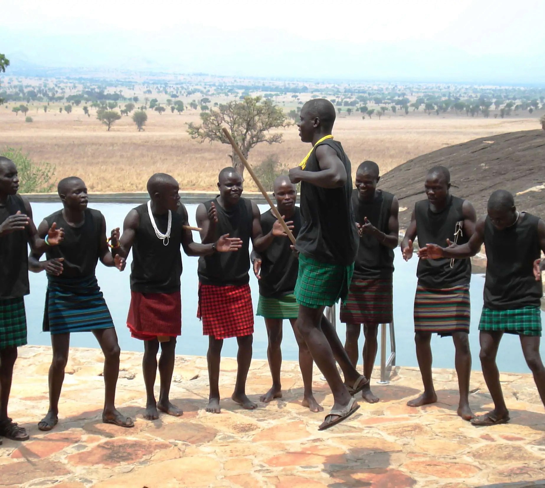 A karamajong cultural troupe entertaining guests at a lodge in Kidepo Valley National Park