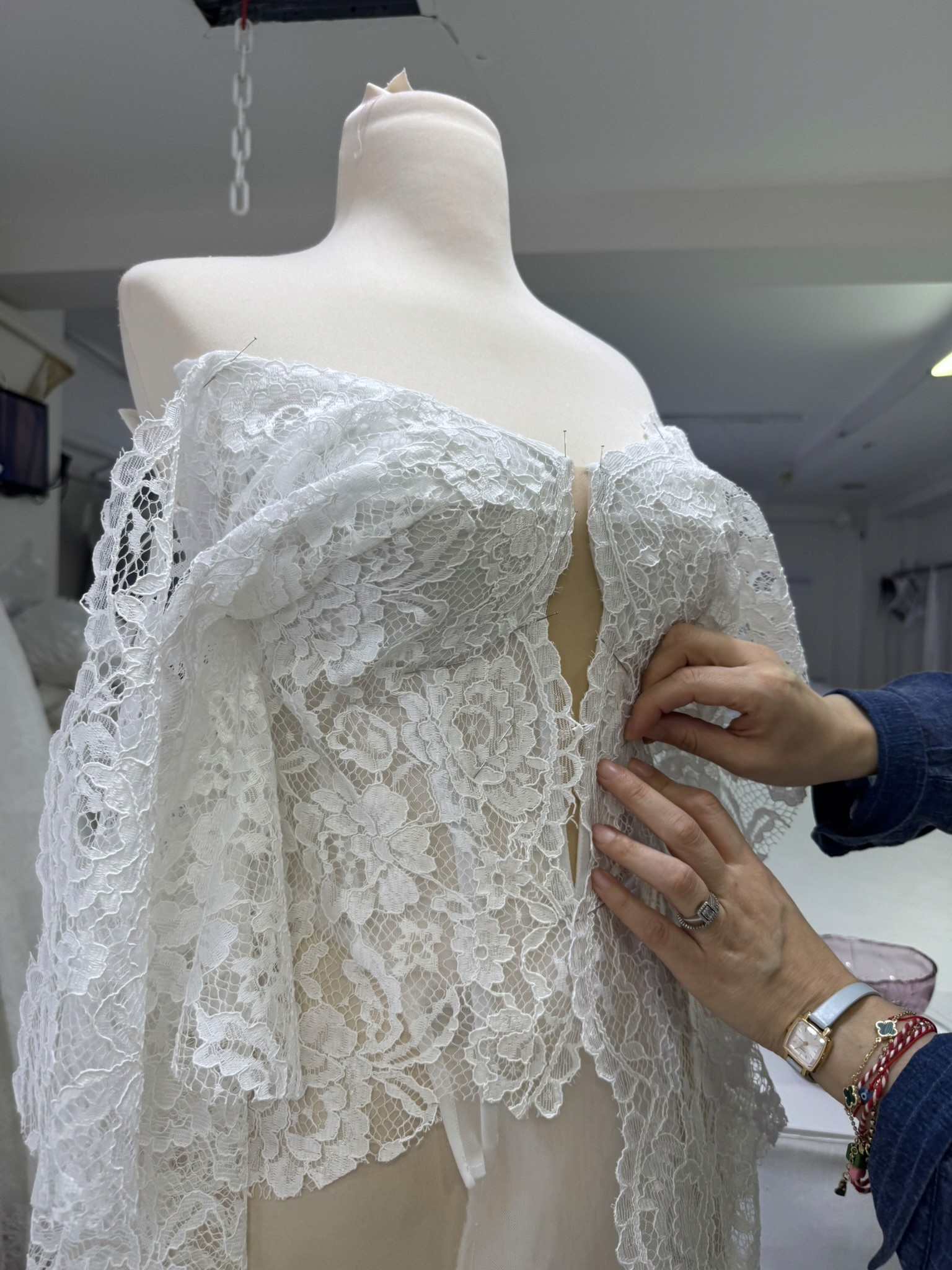 Lucidbride lace placement and embellishment detail on a custom wedding gown.