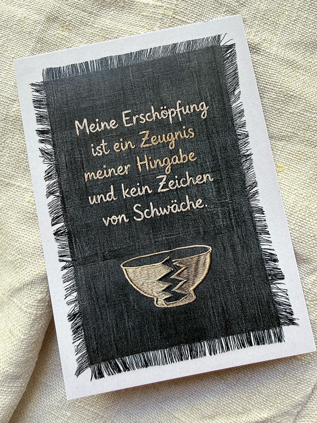 A Card with a embroidered Text