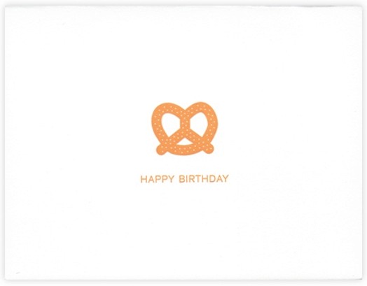 A drawing of an orange pretzel with text: Happy Birthday.