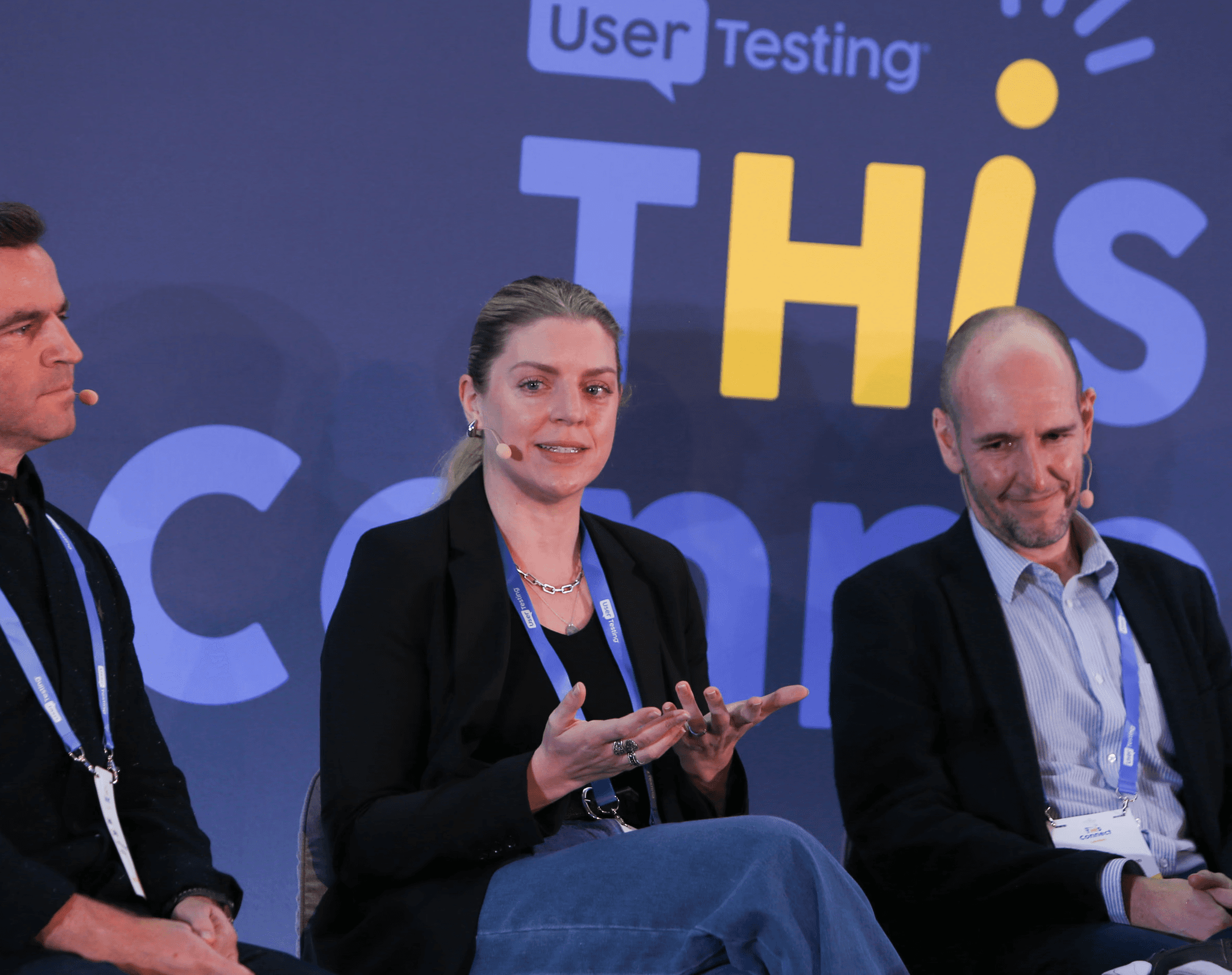 Image of Samantha sitting on a panel with other speakers.
