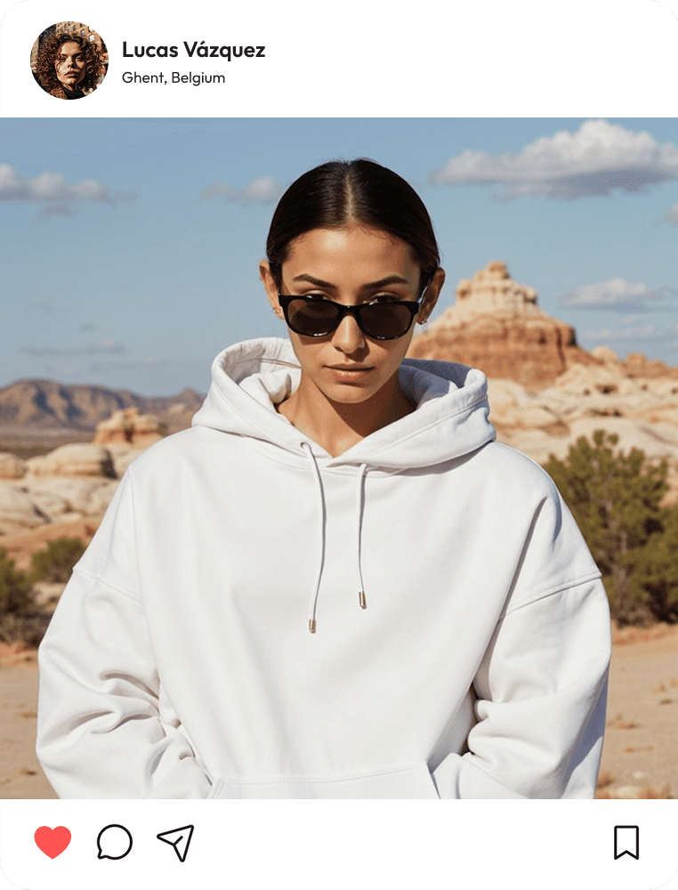A woman in a white hoodie and sunglasses stands confidently, exuding a casual yet stylish vibe.