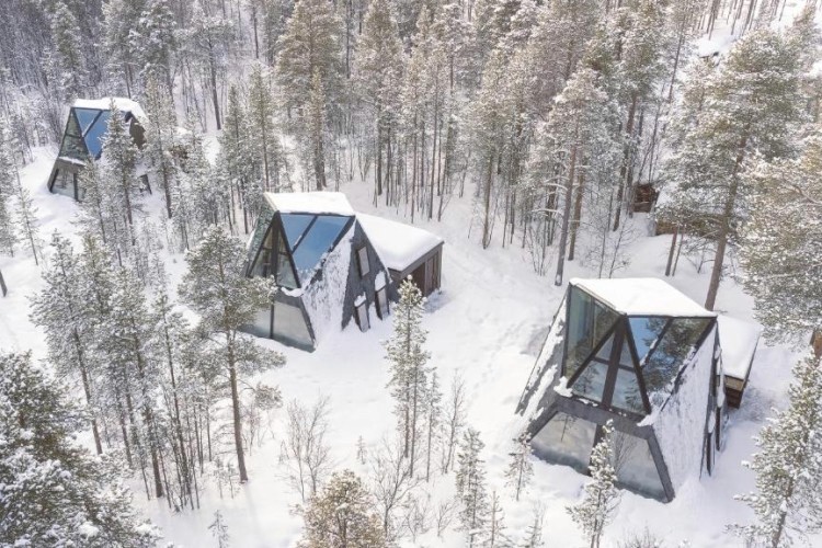 sunloungers fronting buildings near mountain