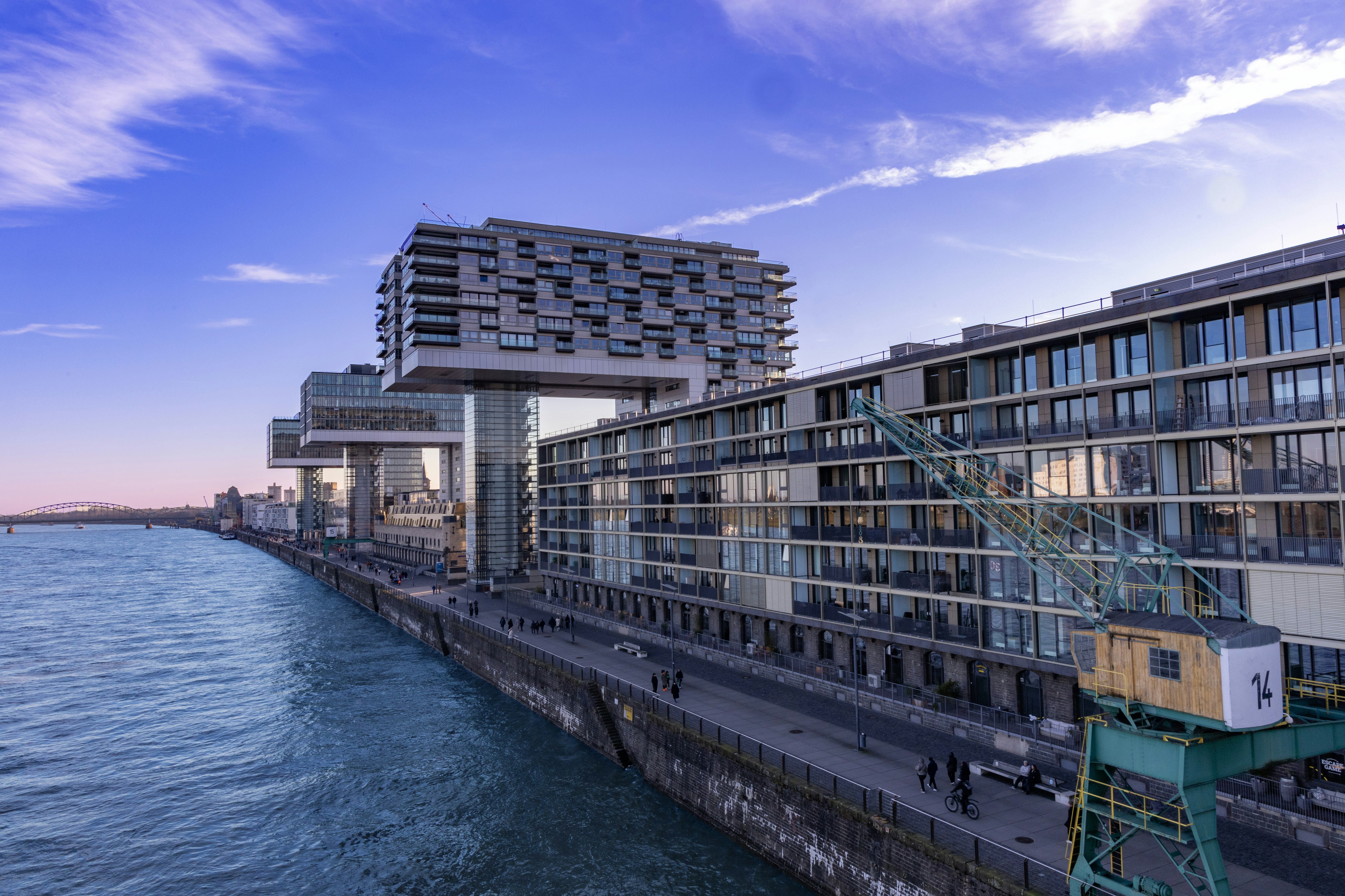 Blurred portrait of a person in an orange patterned shirt with glowing glasses, creating a futuristic and artistic vibe.
