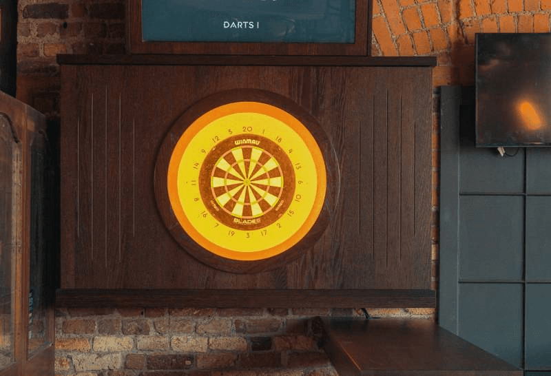 Close-up of a tree stump showing growth rings and a textured brown wood surface.