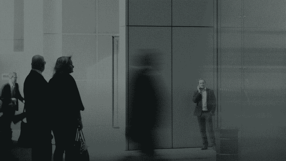 Silhouettes of people in suits networking and working hard