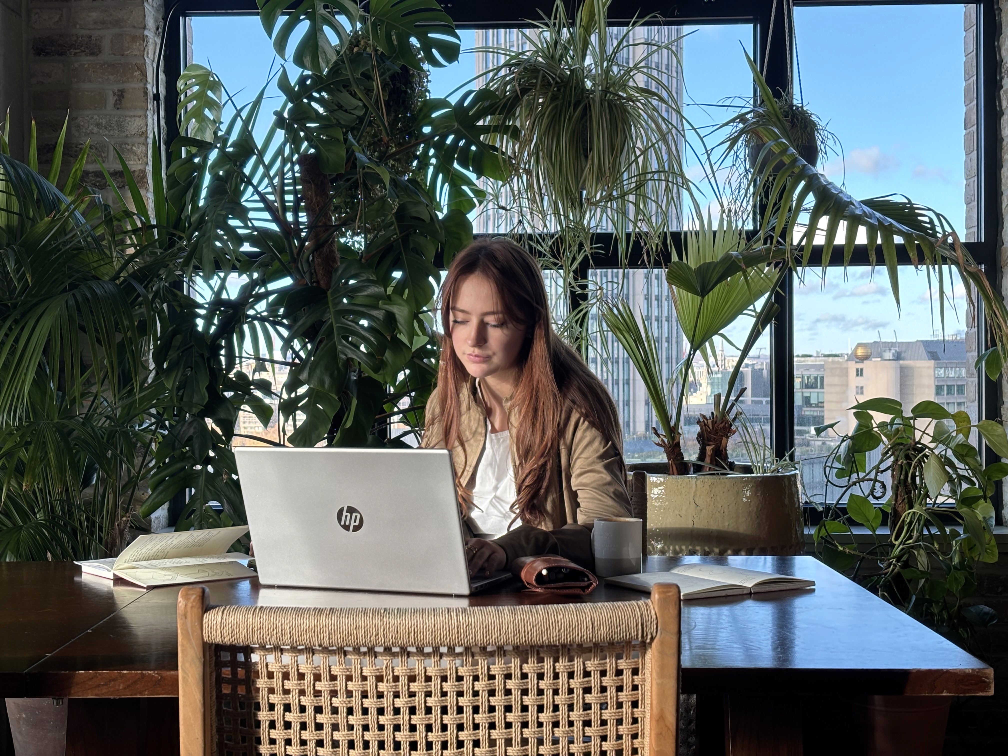 woman holding a phone and man looking at the phone. both are smiling