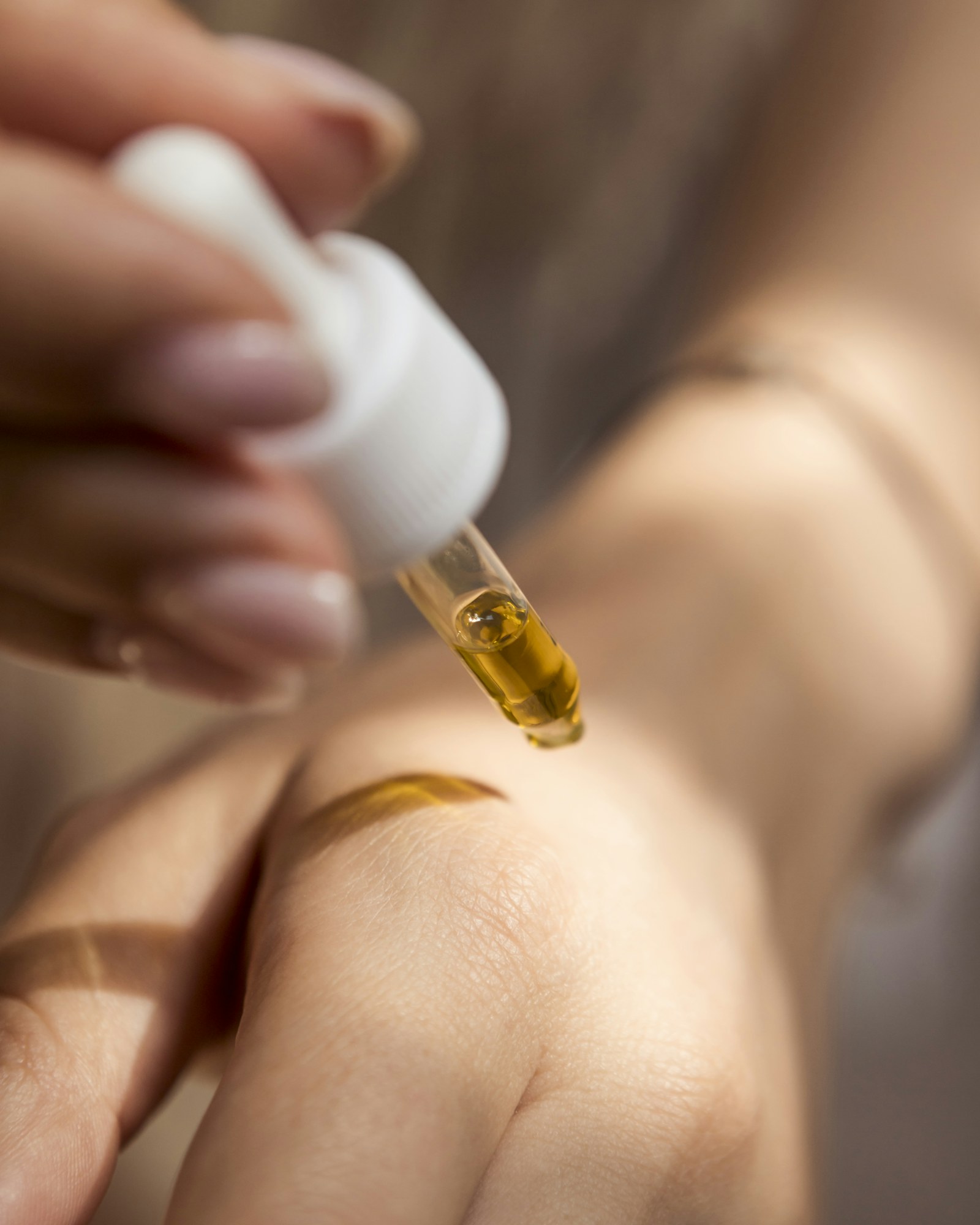 Golden Hour Face Oil dropped onto the back of a hand