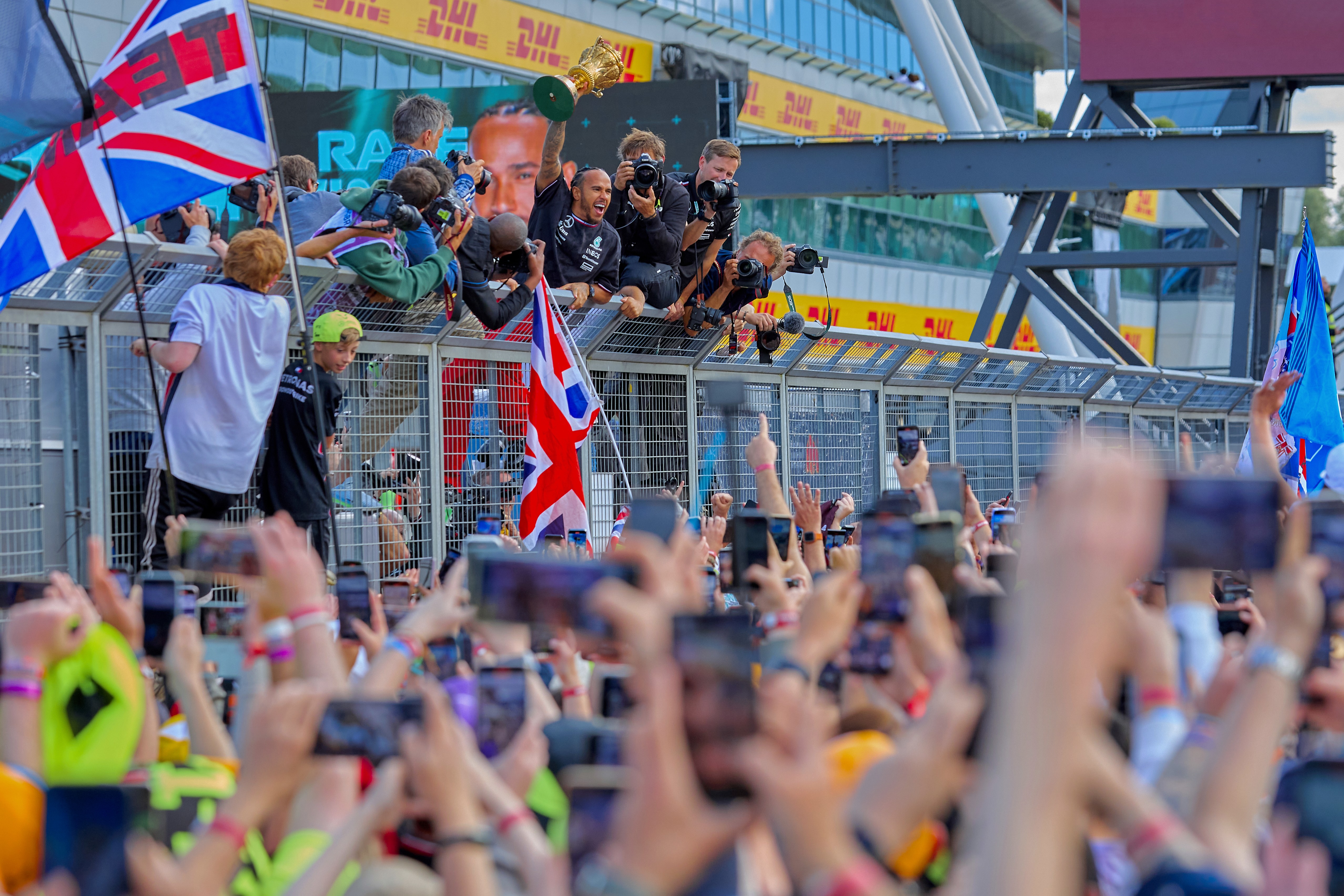 Lewis Hamilton celebrating with spectators at British Formula 1 Grand Prix, from motorsport photography severn images