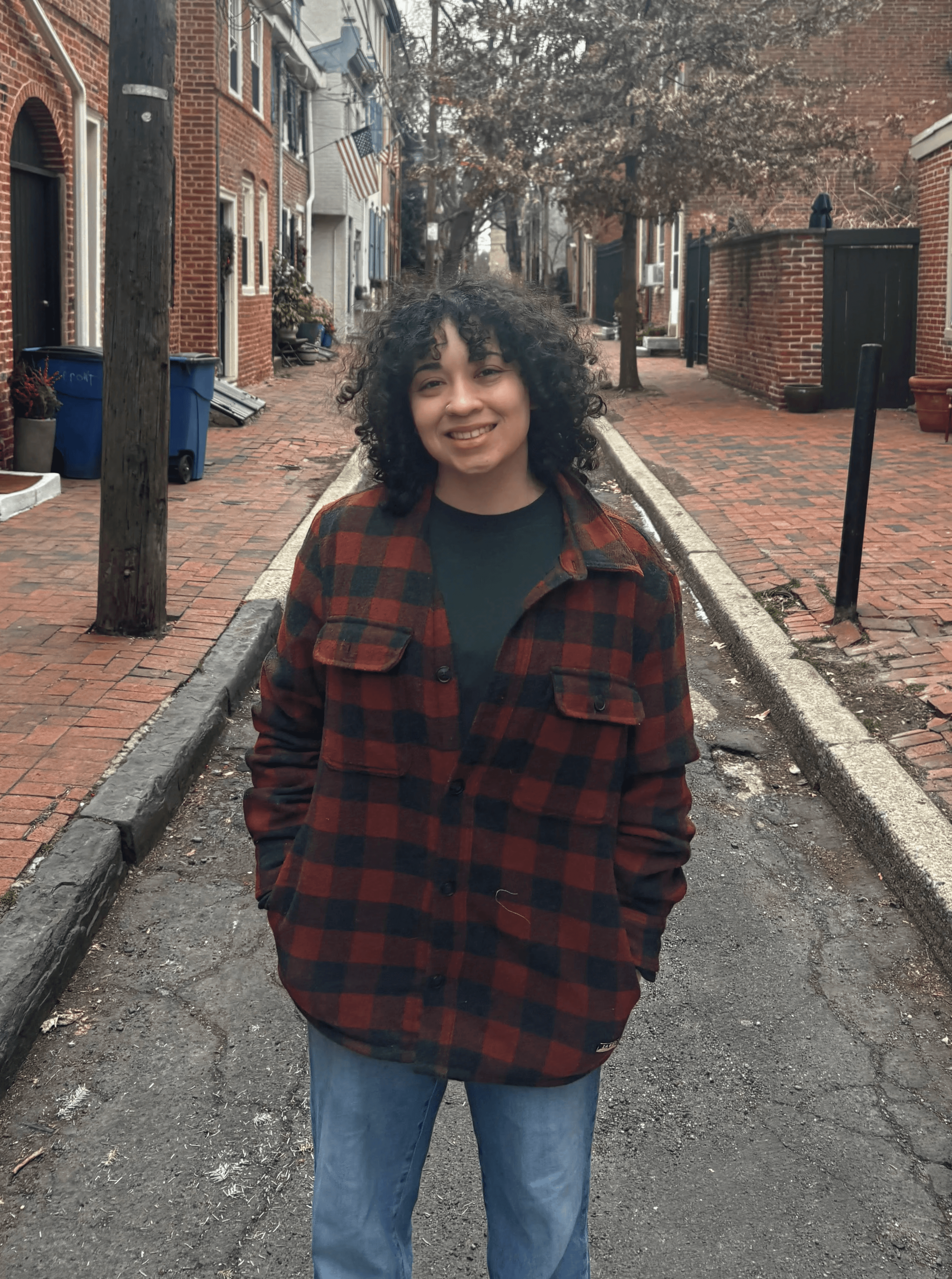 Kate standing on a small street in Philadelphia