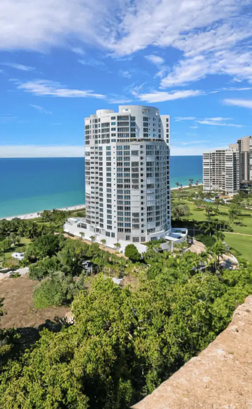 View of a Florida condo featuring impact-resistant windows, offering both coastal charm and protection from hurricanes.