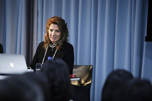 portrait of a woman giving a presentation from her computer