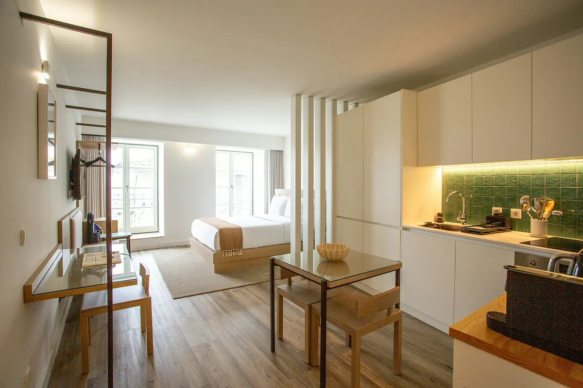 Small, stylish studio apartment with a functional layout.