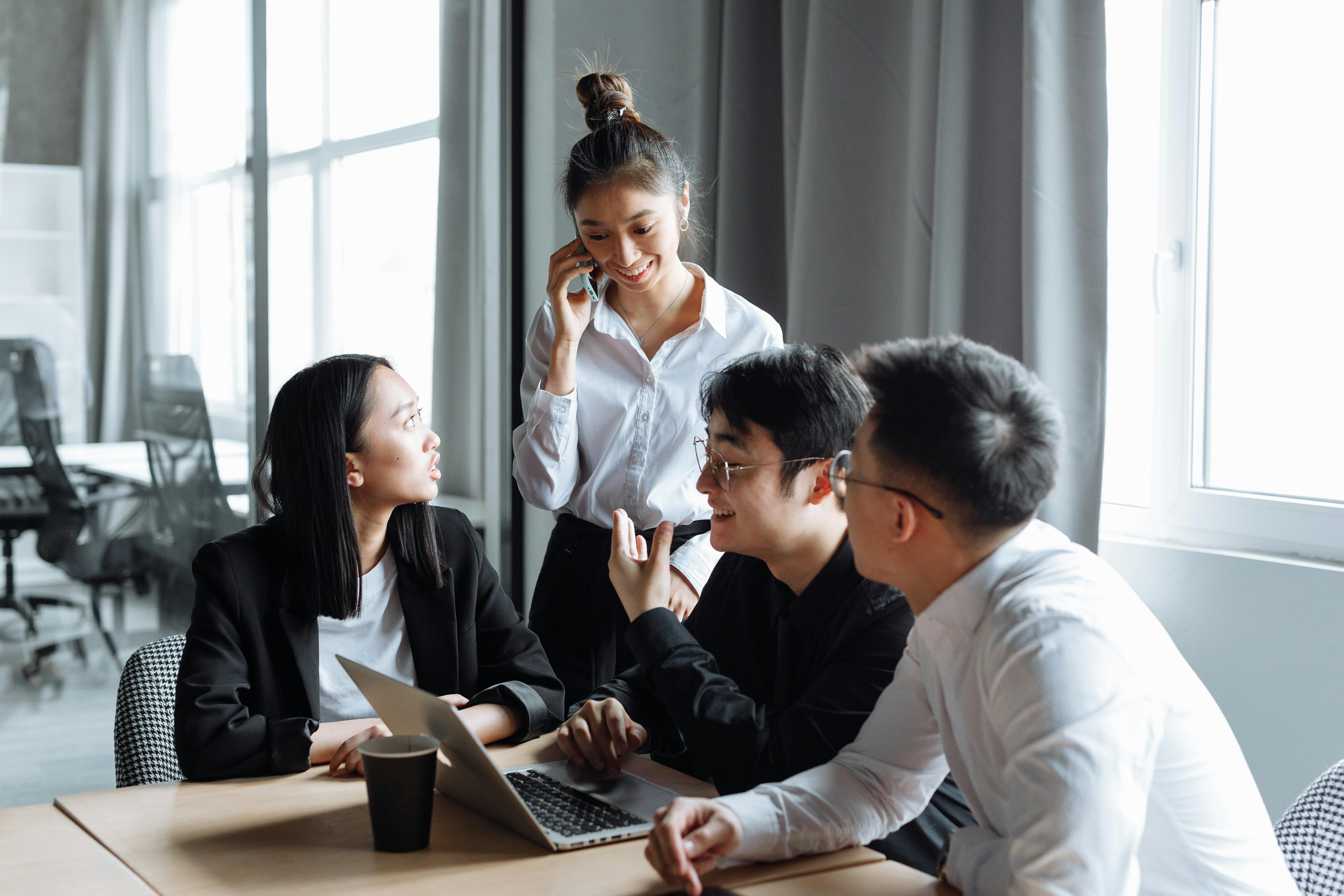 people sitting on chair in front of laptop computers